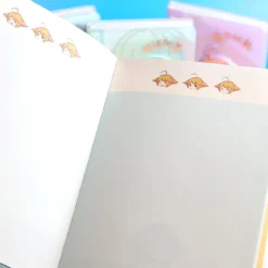 Gullig planner med spänne